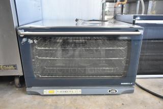 Cadco Unox XAF195 Rossella stainless steel convection oven, full-size, electric, visible controls, and racks, 230-400 volts.