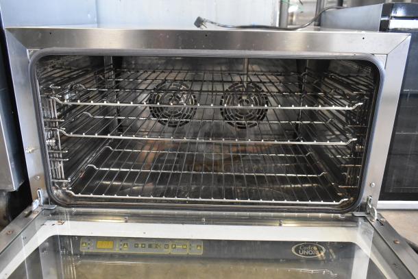 Cadco Unox XAF195 Rossella stainless steel commercial convection oven, visible racks, dual fans, excellent condition.