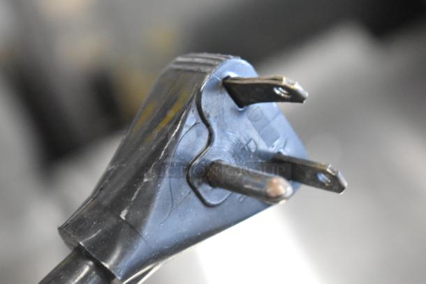 Close-up of a black 3-prong power plug for a Moffat E311 Turbofan convection oven, 220-240 volts.