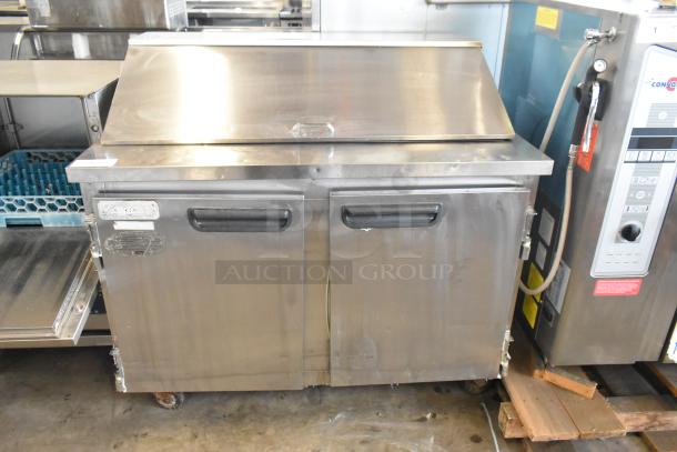 Leader ESSM48 stainless steel sandwich salad prep table, mega top, on commercial casters. Features double doors, 115V, 1 phase.