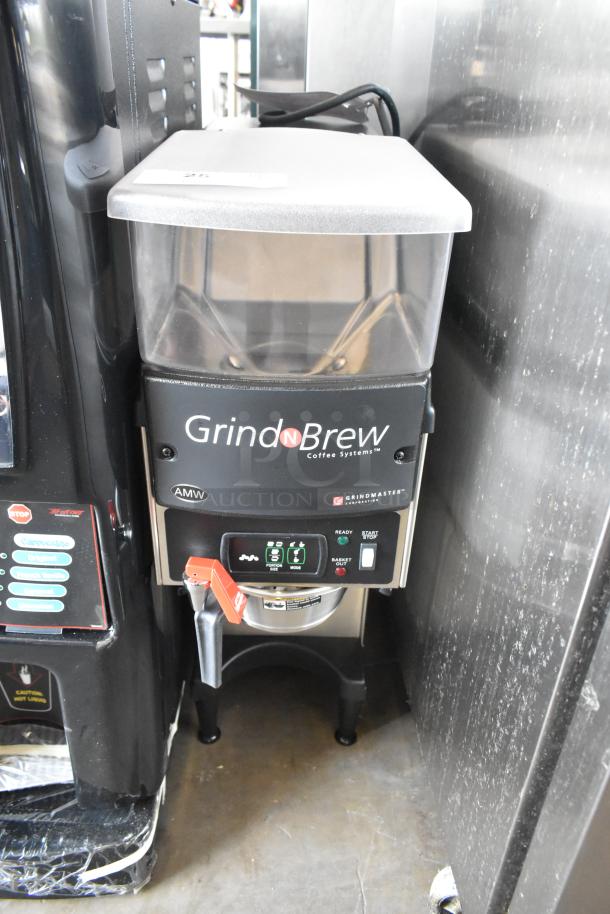 Grindmaster Grind N Brew commercial coffee bean grinder and coffee maker with hot water dispenser, metal brew basket; excellent condition.