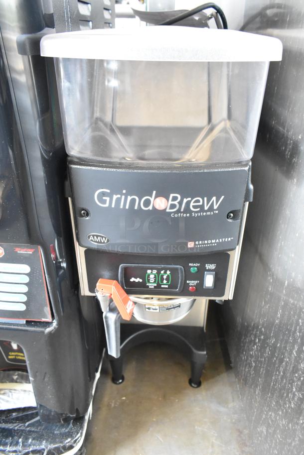 Grindmaster Grind N Brew stainless steel commercial coffee grinder and maker with hot water dispenser, metal brew basket.
