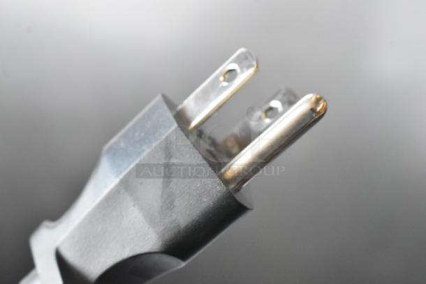 Close-up of a three-prong plug for the Cecilware GB5MFIT commercial cappuccino machine, 120 volts, 1 phase.