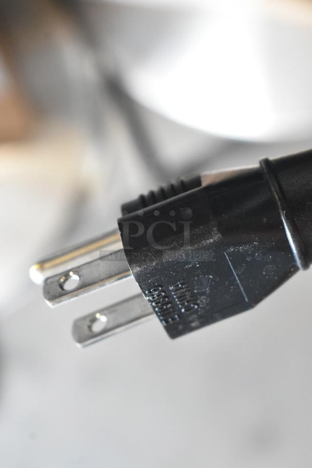 A three-prong plug of a Cecilware LTB-105-1R iced tea machine, showcasing compatibility with 120 volts, 1 phase.