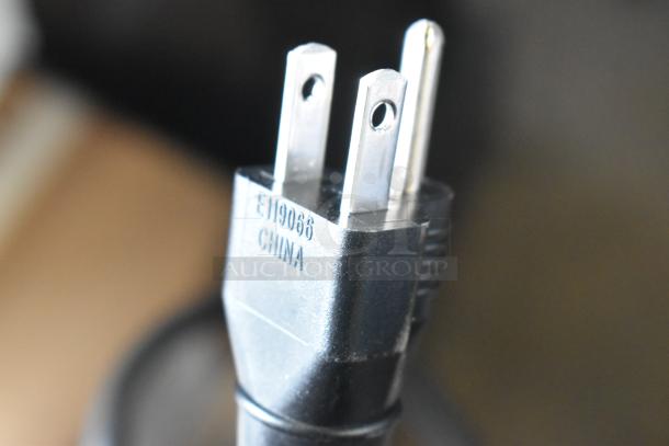 Close-up of plug for Cecilware LTB-105-1R countertop iced tea machine, labeled "E119066 CHINA."