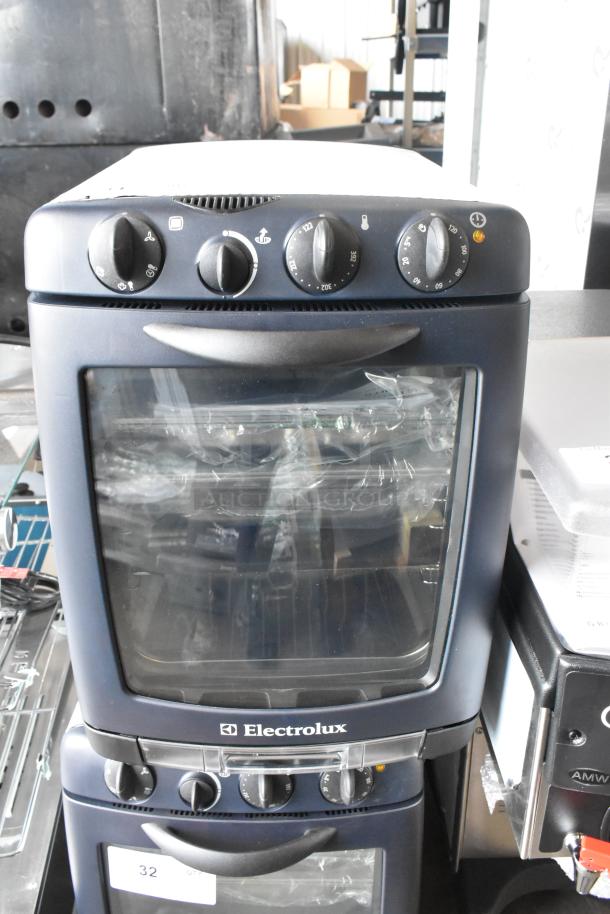 Brand new Electrolux OTS100 countertop mini combi steamer, scratch and dent condition, 110V, 1 phase, visible knobs.