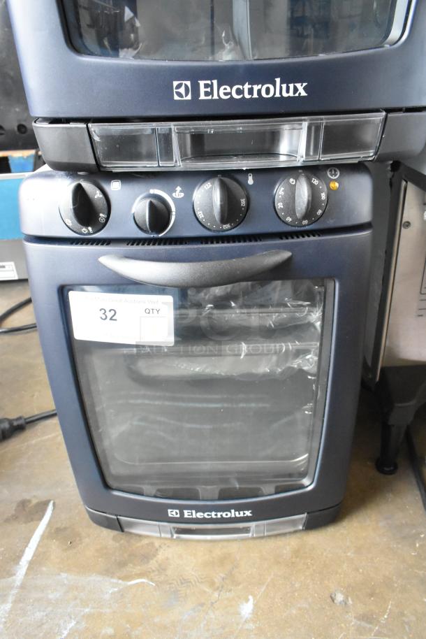 BRAND NEW Electrolux OTS100 mini combi steamer, scratch and dent, metal countertop, 110V, 1 phase. Visible control panel.
