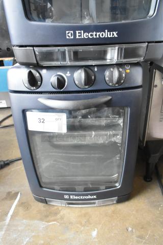 BRAND NEW Electrolux OTS100 mini combi steamer, scratch and dent, metal countertop, 110V, 1 phase. Visible control panel.