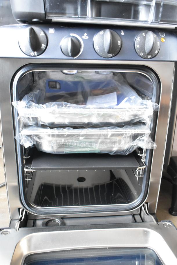Brand new Electrolux OTS100 mini combi steamer, metal finish, scratch and dent, 110V, 1 phase. Includes packaging.