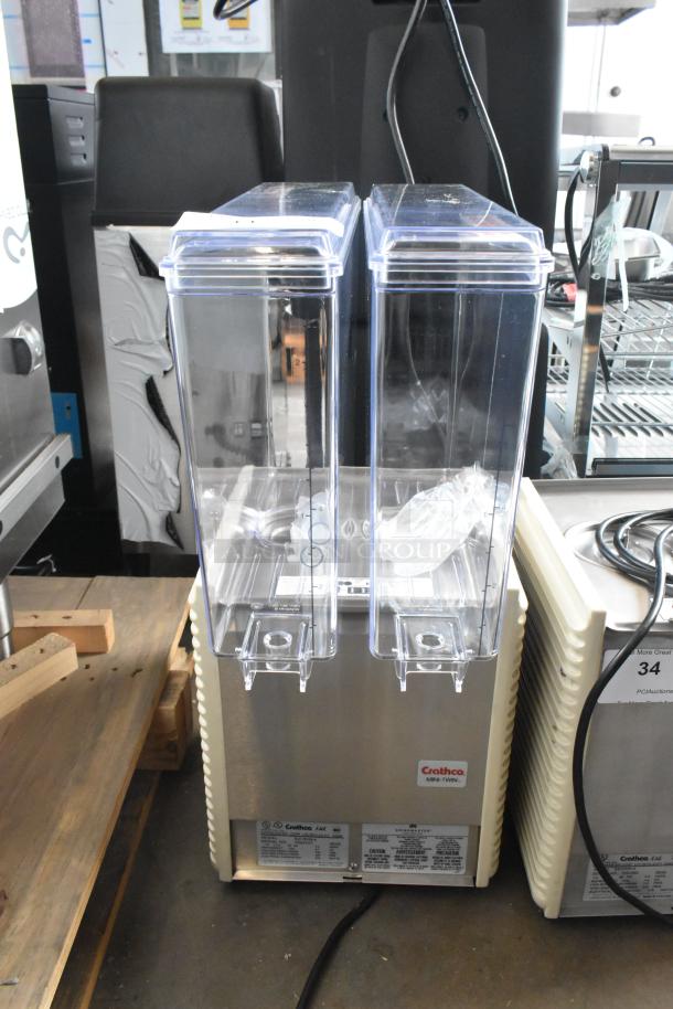 Brand new Crathco E27/E29-4 beverage machine, 2 hoppers, stainless steel, 115V, 1 phase, slight cosmetic damage.