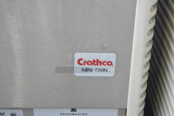 Crathco E27/E29-4 commercial beverage machine, dual hoppers, new with minor scratches/dents. Label: Crathco Mini-Twin. 115V, 1 phase.