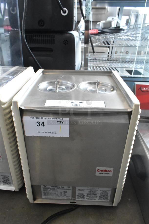 Brand new Crathco E27/E29-4 beverage machine base, 2 hoppers, metal construction, 115V, 1 phase. Tags show model info.