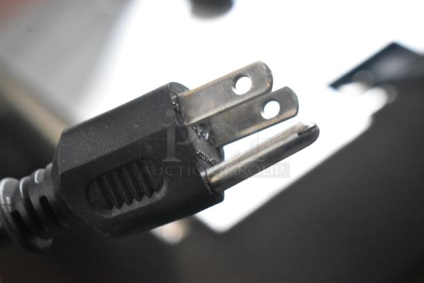 Close-up of a power plug for Crathco E27/E29-4 beverage machine base, 115 volts, new condition.