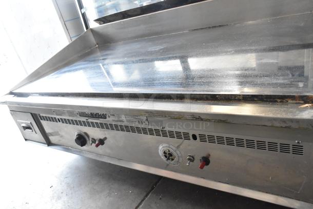 Keating Miraclean ABX3D stainless steel commercial gas griddle with chrome top, thermostatic controls, and visible wear.
