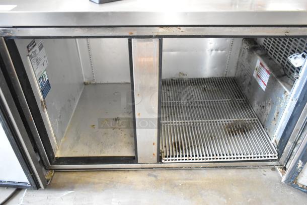 2023 True TWT-60-32F-HC stainless steel 2-door worktop freezer, visible wear, 115V, model tag readable.