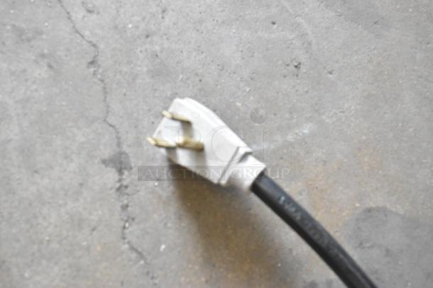 2023 True TWT-60-32F-HC commercial work top freezer plug. 115 volts, 1 phase. Black cord, two-prong plug visible.