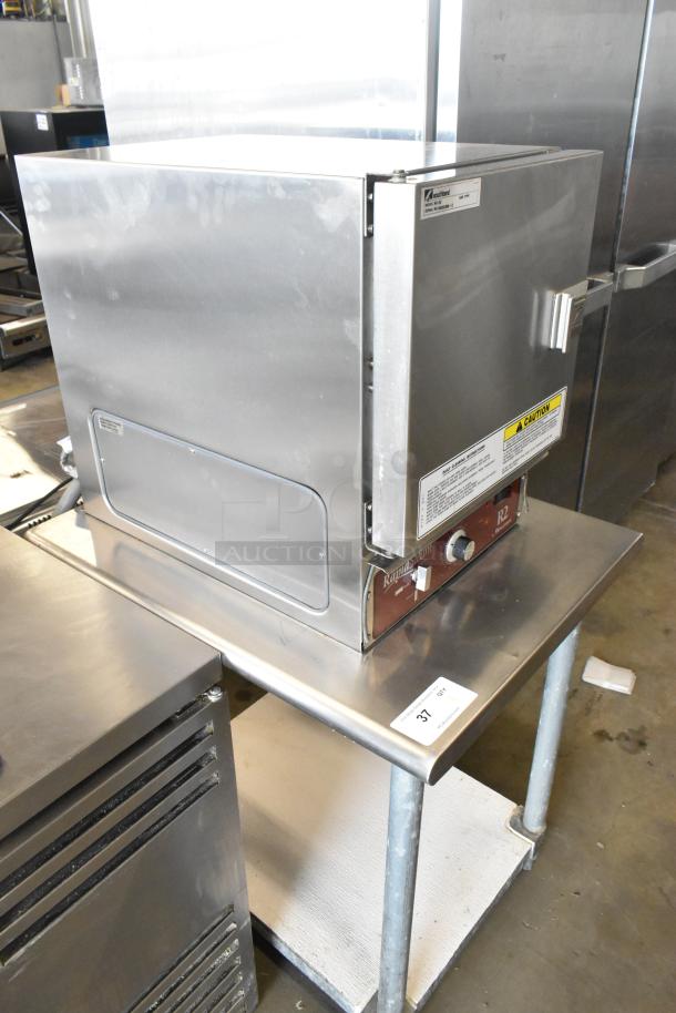 Southbend R2 RapidSteam stainless steel gas steam cabinet on a stainless steel table. Single compartment, caution labels visible.