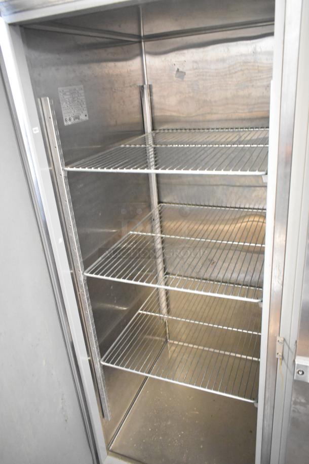 2024 Hobart QF2 Stainless Steel Commercial 2 Door Reach-In Freezer with poly-coated racks, 120V, 1 phase, interior view.
