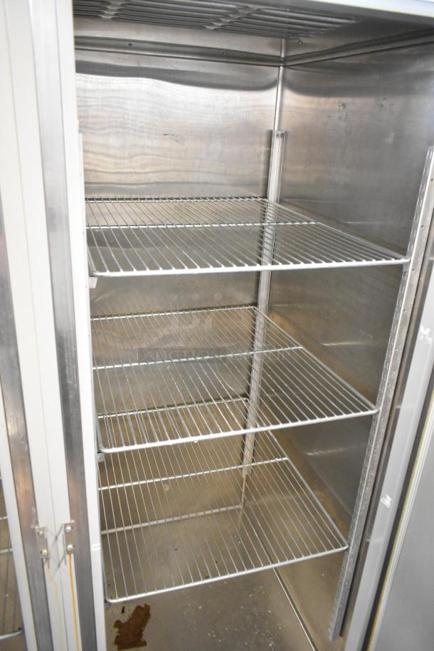 2024 Hobart QF2 stainless steel commercial 2-door reach-in freezer, poly-coated racks, 120 volts, 1 phase, excellent condition.