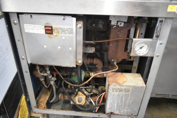 Vulcan VSX24G Stainless Steel Steam Cabinet, natural gas, 2 compartments, 200,000 BTU, shows internal components and gauge.