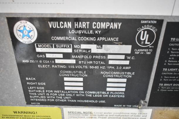 Vulcan VSX24G label showing model, natural gas, 200,000 BTU, 115V, commercial steam cabinet specifications.