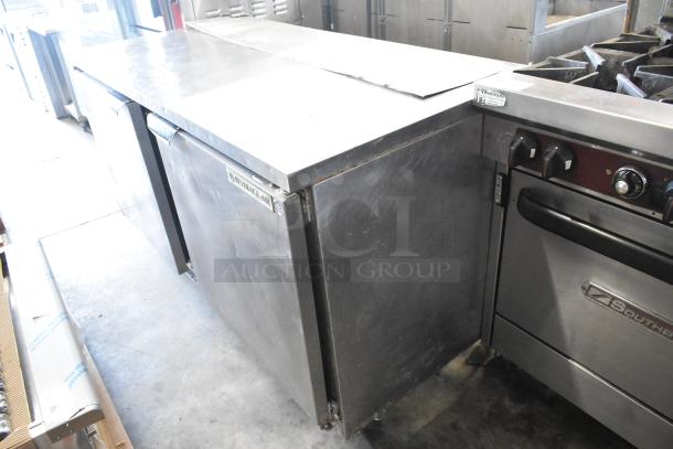 Beverage Air stainless steel 2-door undercounter cooler on casters, 115V, 1 phase, in commercial kitchen setting.