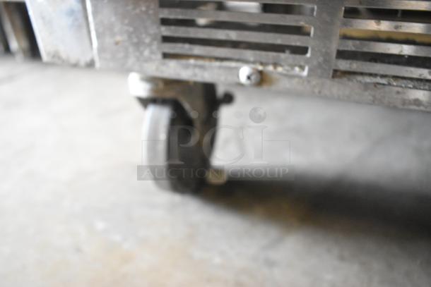 Beverage Air stainless steel undercounter cooler on casters. Commercial grade, 2 doors, 115 volts, 1 phase, visible wheel detail.