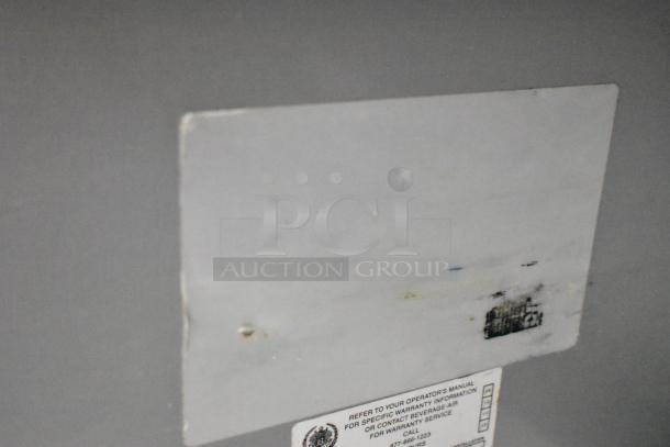 Beverage Air stainless steel 2-door undercounter cooler on casters. Features 115 volts, 1 phase. Warranty label visible.