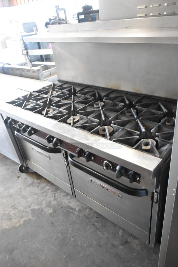 Southbend X460DD commercial stainless steel 10 burner range with 2 ovens, overshelf, backsplash, and casters, in good condition.