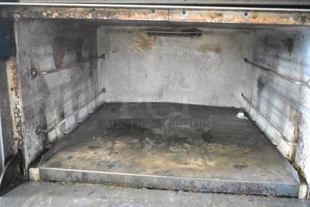 Interior view of Southbend X460DD commercial oven. Shows wear from regular use. Stainless steel interior with visible residue.