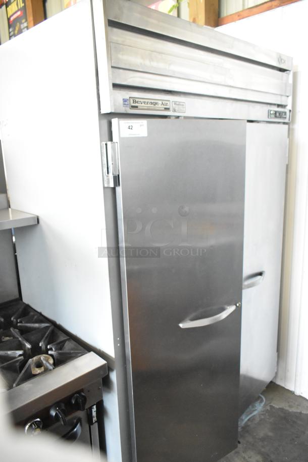 Beverage Air E Series 2-door stainless steel commercial cooler with casters. Left door issue. Visible brand label.