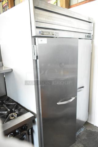 Beverage Air E Series 2-door stainless steel commercial cooler with casters. Left door issue. Visible brand label.