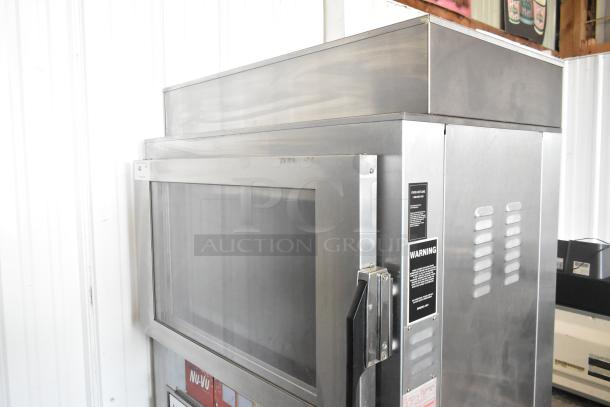 Nu Vu SUB-123P stainless steel commercial oven proofer, electric-powered, on casters, 208V, 3-phase, excellent condition, visible warning label.