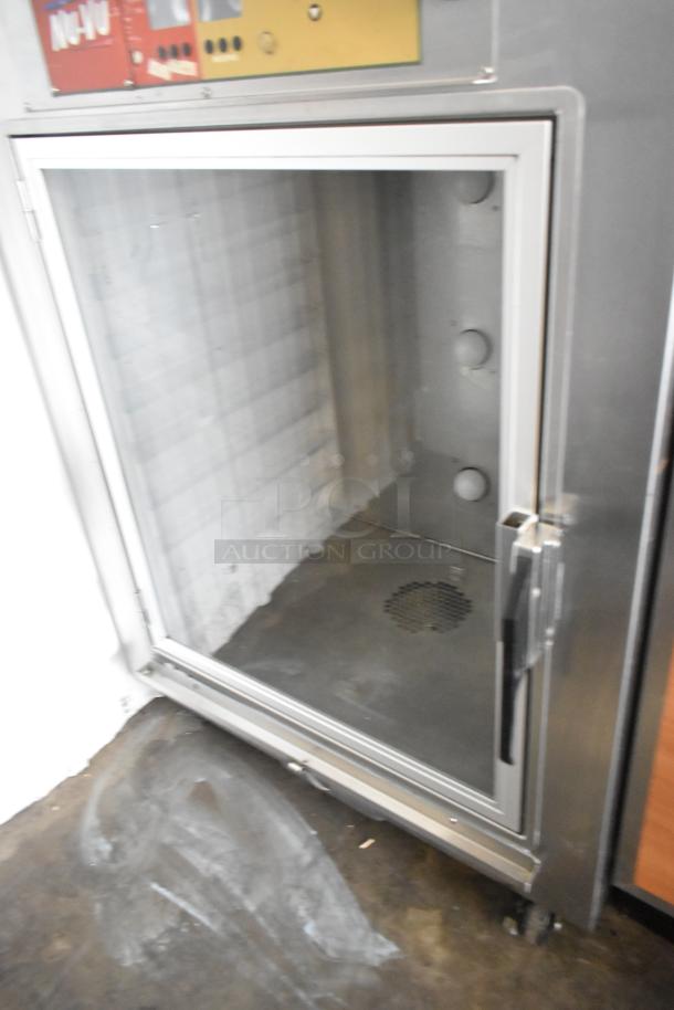 Nu Vu SUB-123P stainless steel commercial oven proofer on casters, 208V, 3-phase. Open door showing interior.