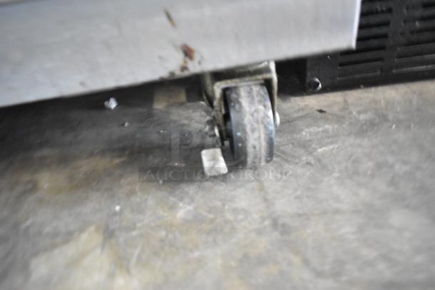 Nu Vu SUB-123P stainless steel oven proofer caster, highlighting wear. Electric, 208V, 3 phase, commercial grade.