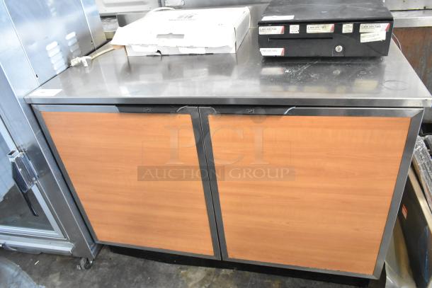 Duke RUF-48M stainless steel commercial 2-door work top cooler, 120 volts, 1 phase. Features wood panel doors.