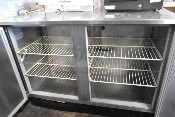 Duke RUF-48M stainless steel commercial 2-door work top cooler, 120 volts, 1 phase, good condition with wire shelving.