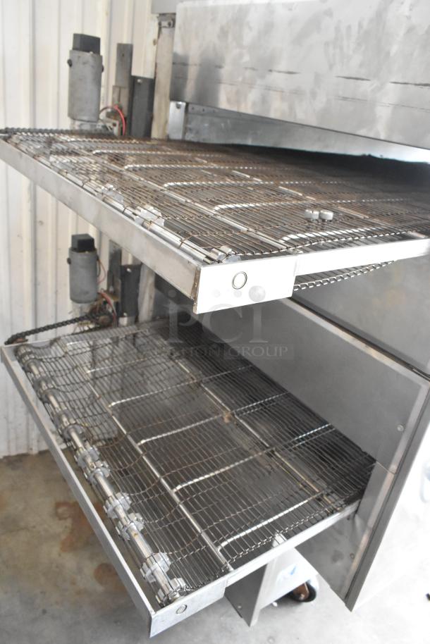 Middleby Marshall PS360 stainless steel conveyor pizza oven, natural gas, 135,000 BTU, on commercial casters.