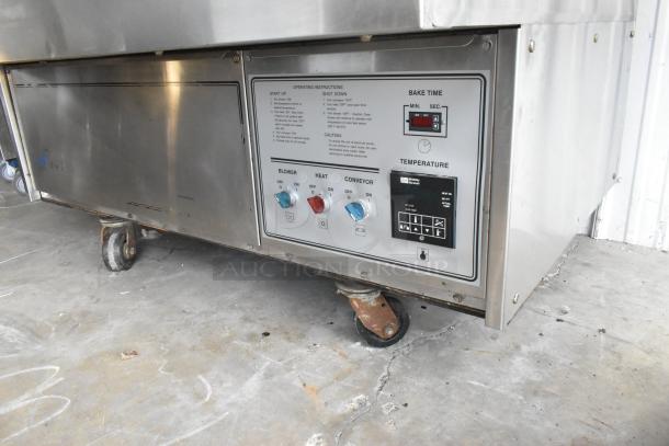 Middleby Marshall PS360 stainless steel conveyor pizza oven, natural gas, 135,000 BTU, on casters, control panel visible.