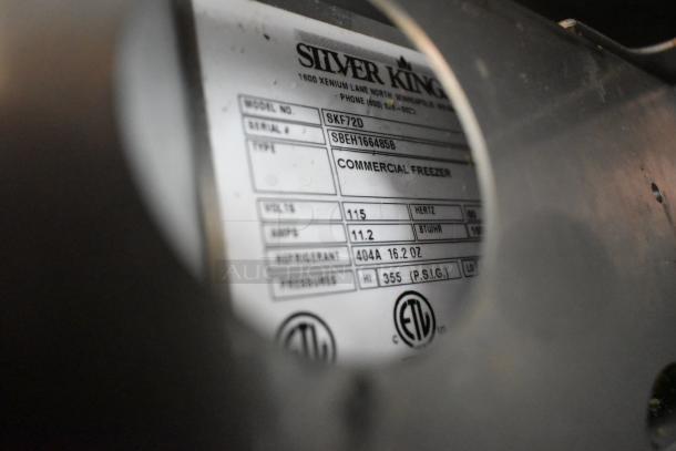 Silver King SKF72D label showing specs: 115 volts, 1 phase, 11.2 amps, refrigerant 404A, for commercial freezer.