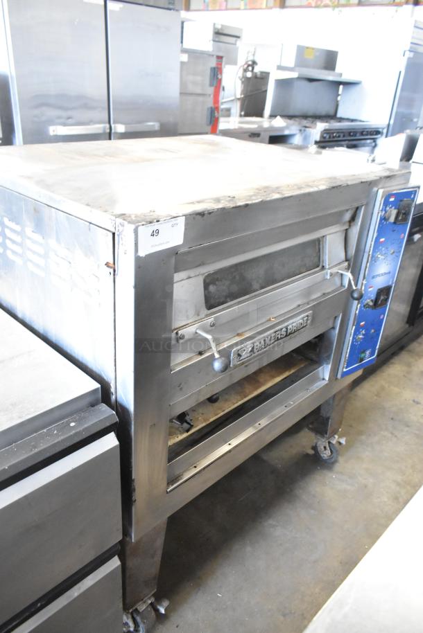 Bakers Pride EP-2-2828 SuperDeck stainless steel commercial pizza oven on metal legs with casters; lower door detached, 208V, 1-phase.