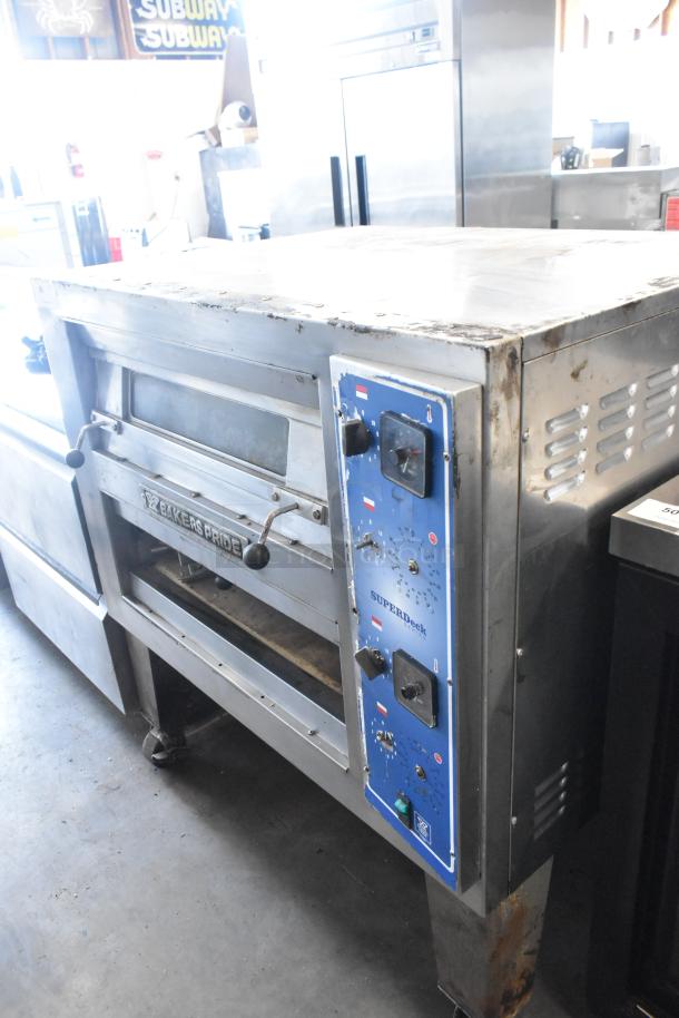 Bakers Pride EP-2-2828 SuperDeck pizza oven, stainless steel, 2 decks, on metal legs, lower door needs reattachment.