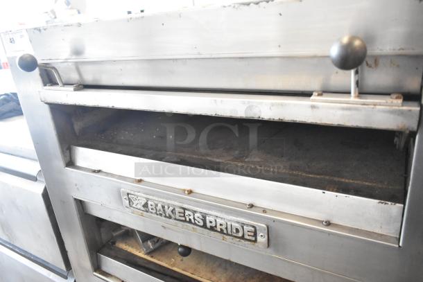 Bakers Pride EP-2-2828 stainless steel 2-deck pizza oven, commercial grade, missing lower door, on metal legs and casters. 208V, 1 phase.