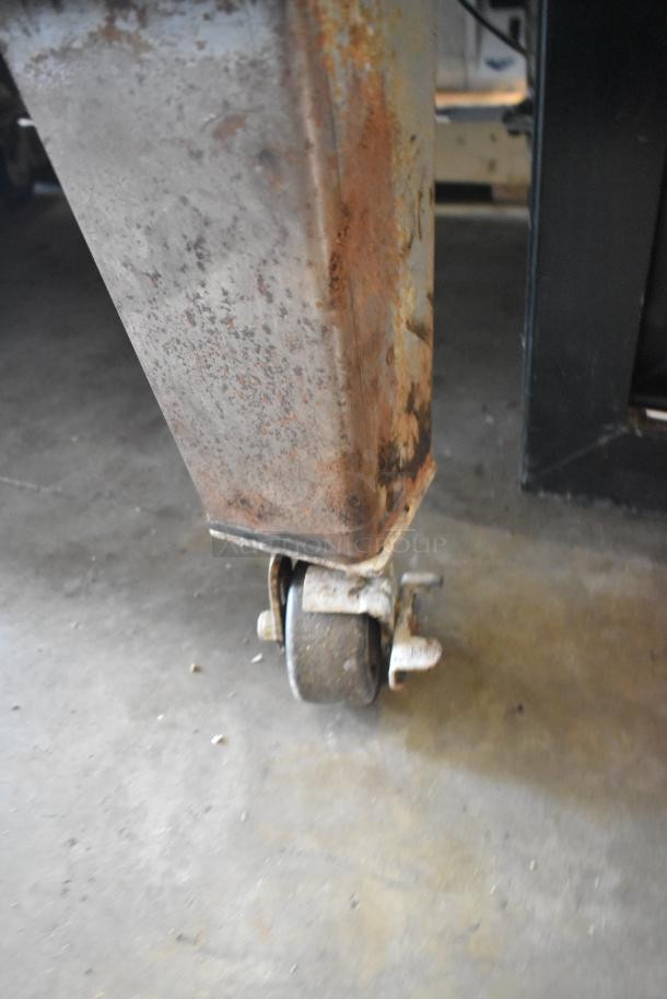 Bakers Pride EP-2-2828 pizza oven on casters; stainless steel; needs lower door reattached; 208 volts, 1 phase.