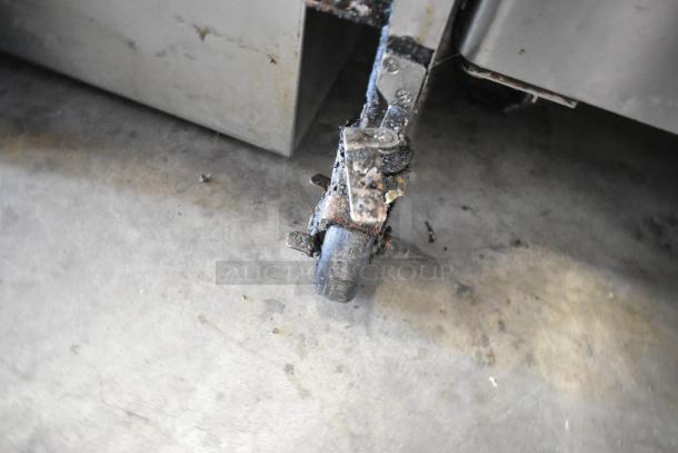 2019 Henny Penny OFG-322 deep fryer on casters. Shows wear with signs of use; 170,000 BTU natural gas powered.