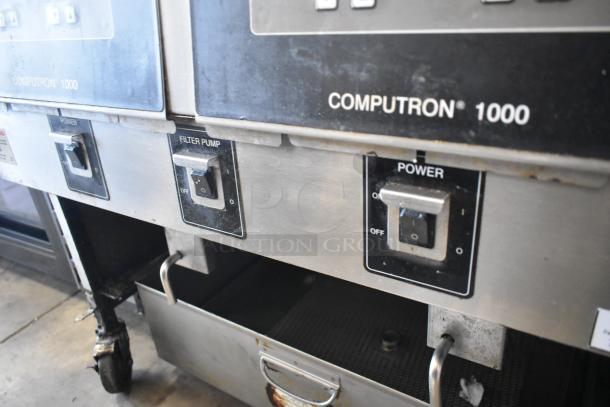 2019 Henny Penny OFG-322 Computron 1000 stainless steel natural gas fryer, 2 bays, 170,000 BTU, on commercial casters.