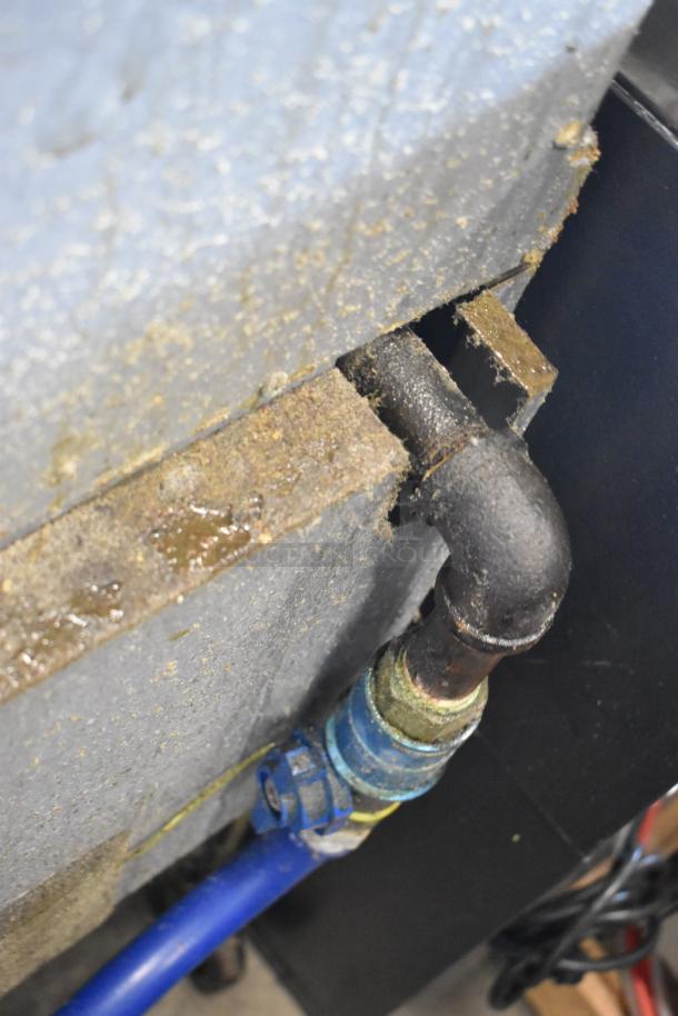 Close-up of natural gas connection on 2019 Henny Penny OFG-322 fryer. Visible signs of wear.