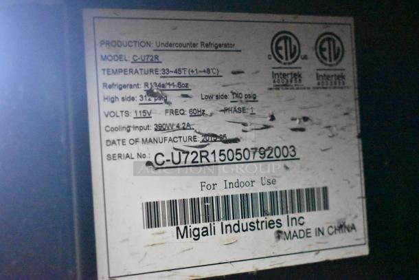 Migali C-U72R stainless steel commercial 3-door undercounter cooler, on casters, 115V, 1 phase, model label showing specs.