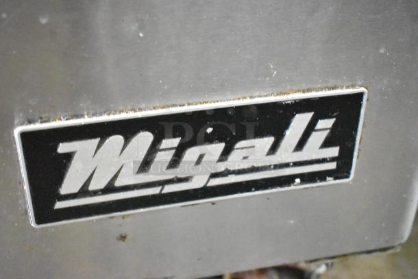 Migali C-U72R logo on stainless steel commercial cooler. Visible wear on label's edges.