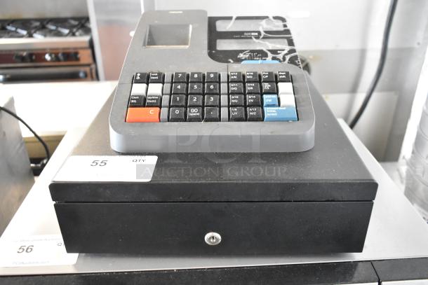 Royal 520DX countertop electronic cash register, 120 volts, 1 phase. Visible wear, black and grey design, lockable cash drawer.